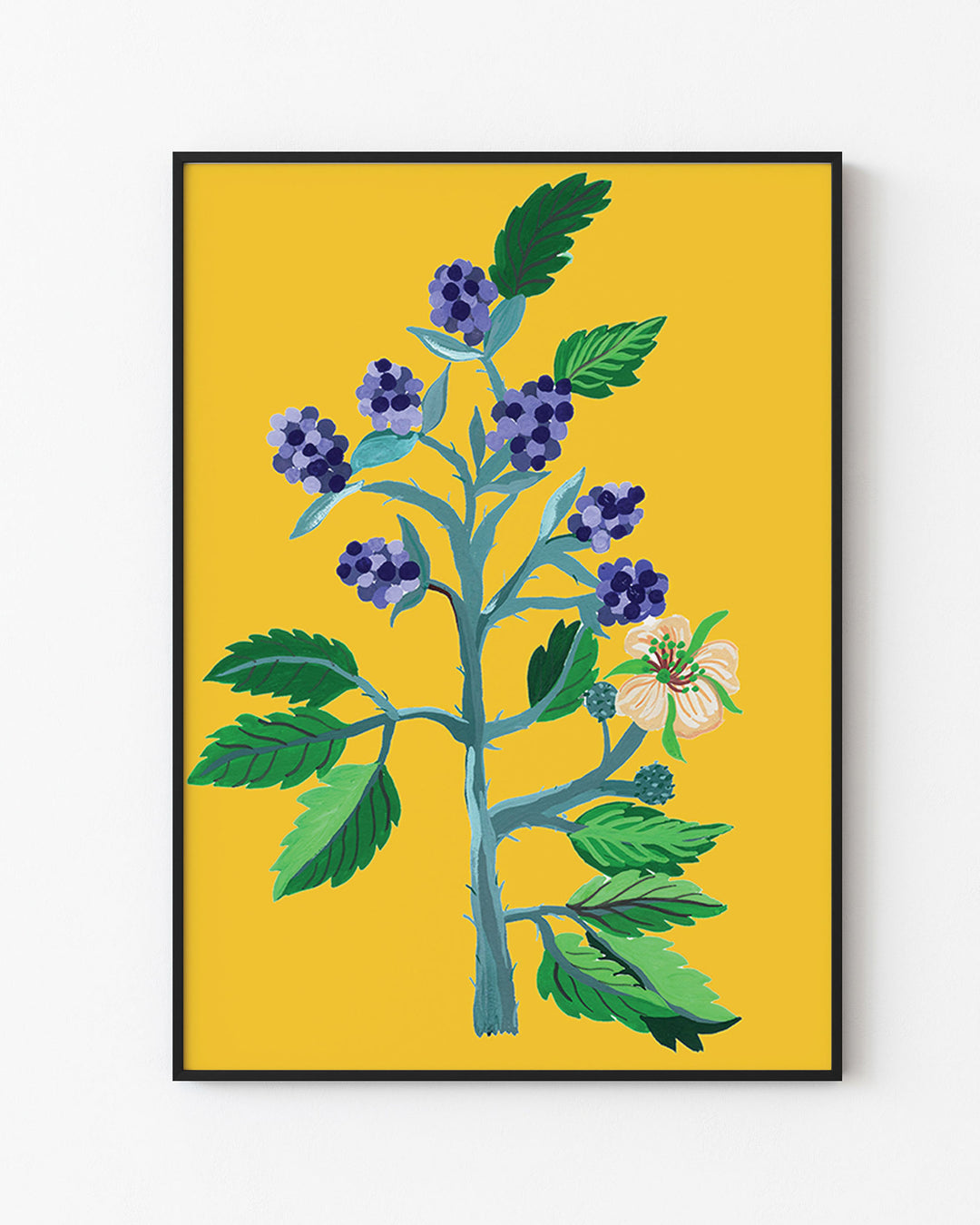 Decorative Black Framed Artwork from Little Berries Studio with a botanical illustration of blue berries and green foliage on a bright yellow background.