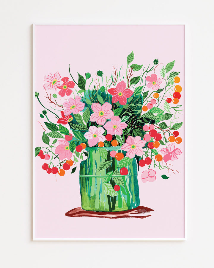 White Framed Artwork by Little Berries Studio featuring a lush bouquet of pink flowers and green leaves in a green vase, set against a soft pink background.