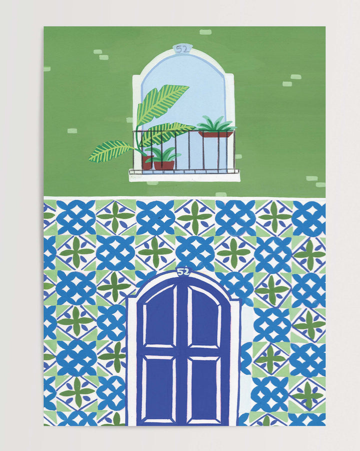 Art Print of a Mediterranean-style building with a vibrant blue door, patterned mosaic tiles, and a small balcony featuring tropical potted plants.