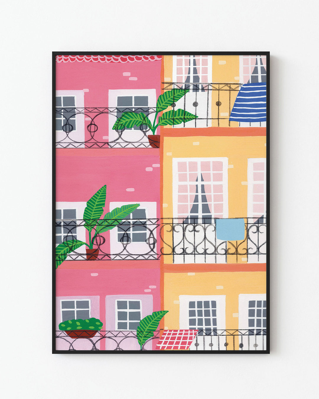 Black Frame Art Print titled "Door Urban Pastels", featuring a vibrant illustration of colourful pastel buildings with balconies adorned by potted plants and decor.