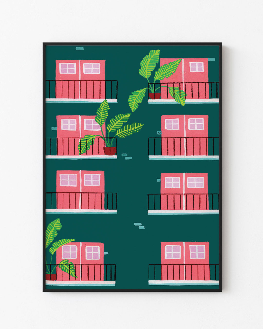 Black Framed Art Print featuring a repeating pattern of pink double doors with windows on green building facades. Each door opens onto a small black railing balcony, and several balconies are adorned with potted tropical plants with large green leaves.