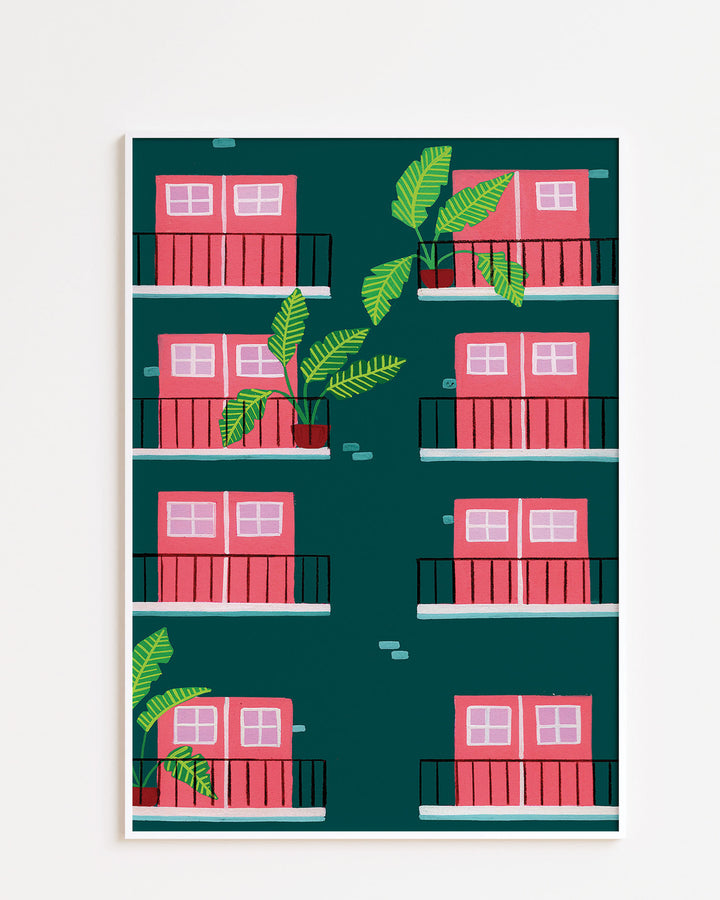 White Framed Art Print featuring a repeating pattern of pink double doors with windows on green building facades. Each door opens onto a small black railing balcony, and several balconies are adorned with potted tropical plants with large green leaves.
