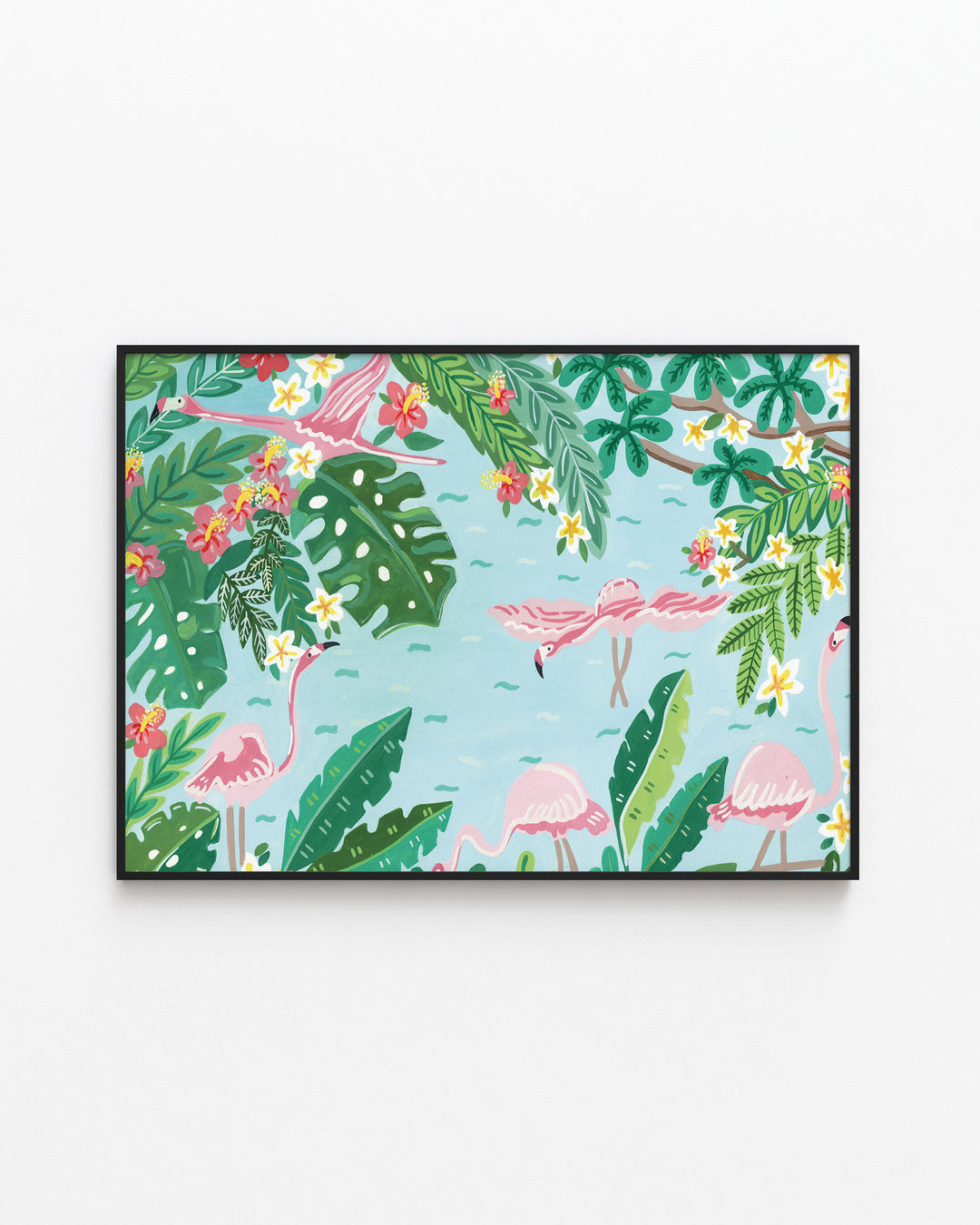 Black Framed Wall Art titled 'Flamingo Festivity' featuring pink flamingos wading in light blue water surrounded by lush green foliage, bright red and yellow flowers, and large tropical leaves.