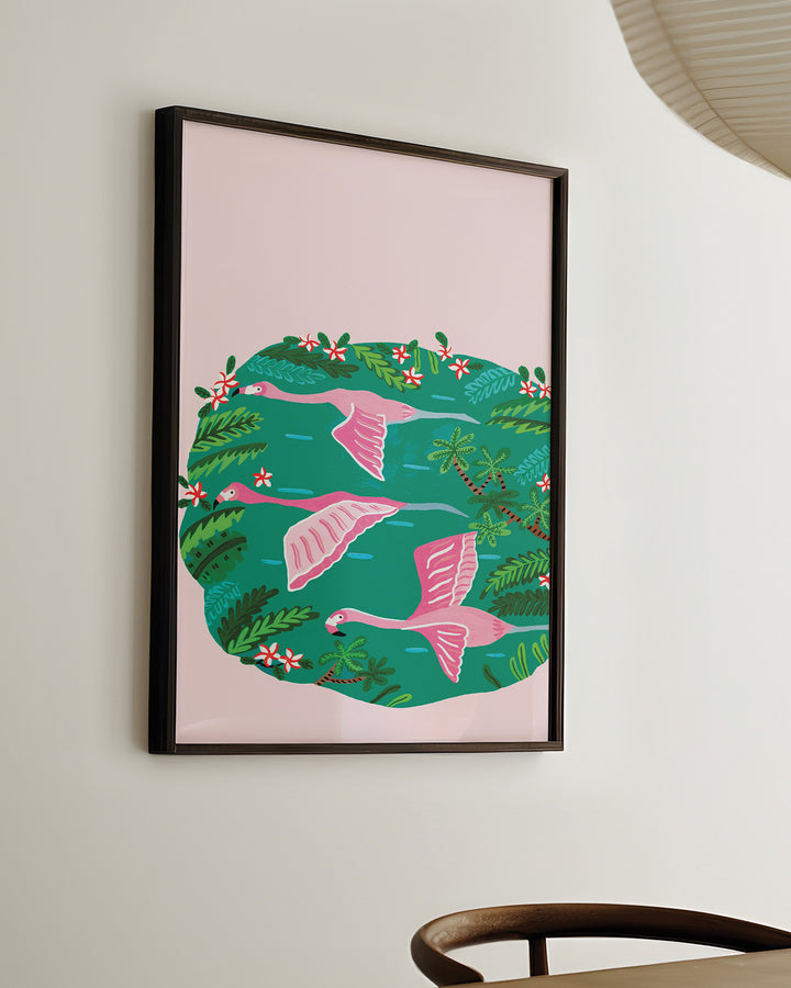 Ready-to-hang Wall Art titled 'Flamingos Sanctuary' depicting pink flamingos flying over a green oasis filled with lush tropical plants and red and white flowers, created by Little Berries Studio.