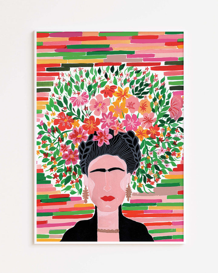 White Framed Artwork of a glorious Frida with a lush floral crown, featuring various vibrant flowers and leaves against a striped background, created by Little Berries Studio.