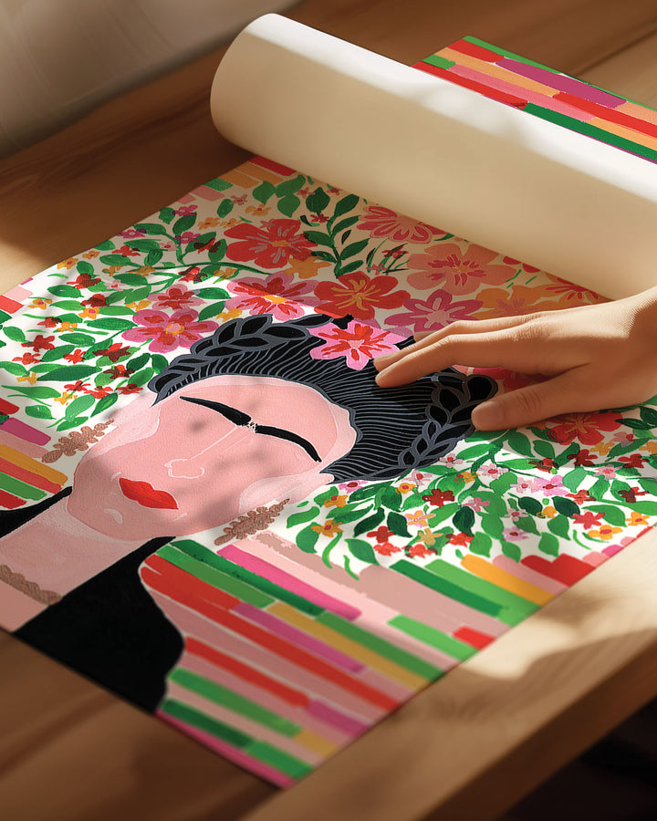 An Archival Art Print of a glorious Frida with a lush floral crown, featuring various vibrant flowers and leaves against a striped background, created by Little Berries Studio.