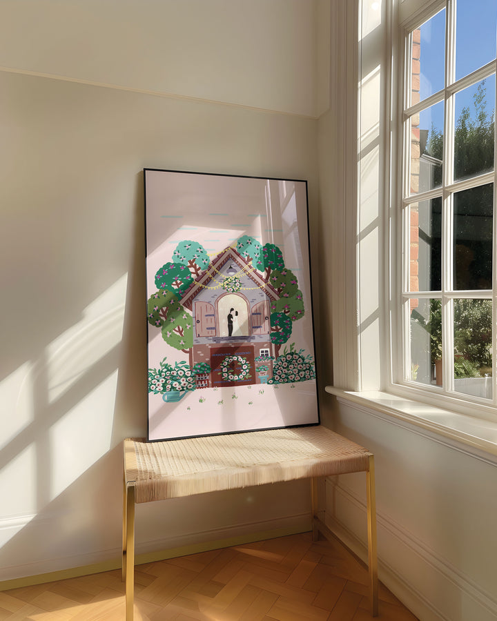 Framed Art Print titled "Floral Romance" by Little Berries Studio, resting on a woven bench near a sunlit window in a bright, airy room.