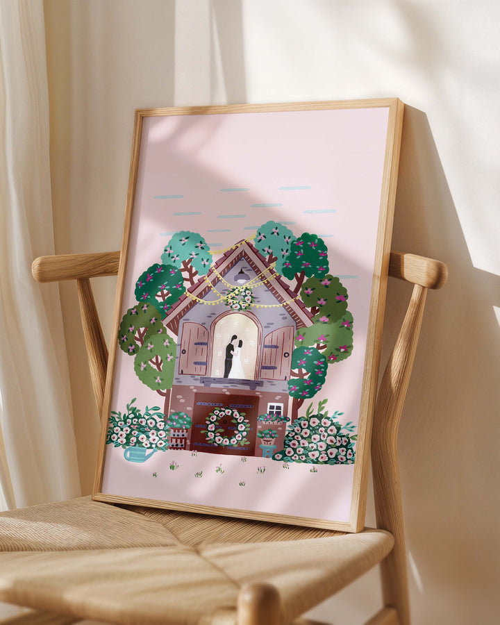 Framed Art Print titled "Floral Romance" by Little Berries Studio, placed on a wooden chair in a softly lit room.