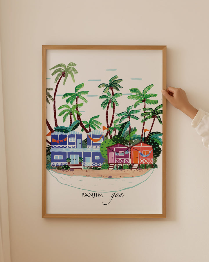 Framed Artwork of colourful beach houses and palm trees in Panjim, Goa by Little Berries Studio, showcasing the tropical charm of this popular Indian coastal destination.
