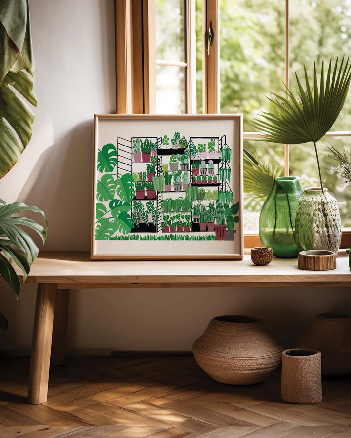 Art Print by Little Berries Studio featuring an illustration of potted plants on shelves, displayed on a wooden table near a window with decorative vases and indoor plants in a cosy, sunlit room.