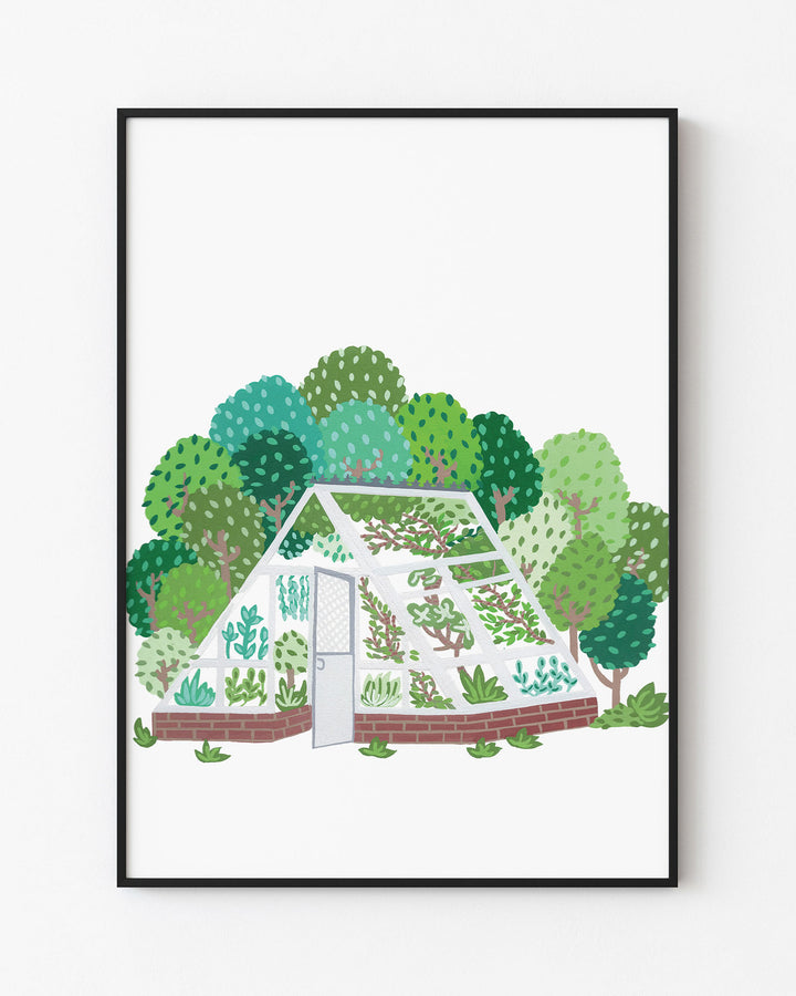 Black Framed Art Print by Little Berries Studio depicting an illustrated greenhouse filled with plants, surrounded by a lush landscape of green trees.