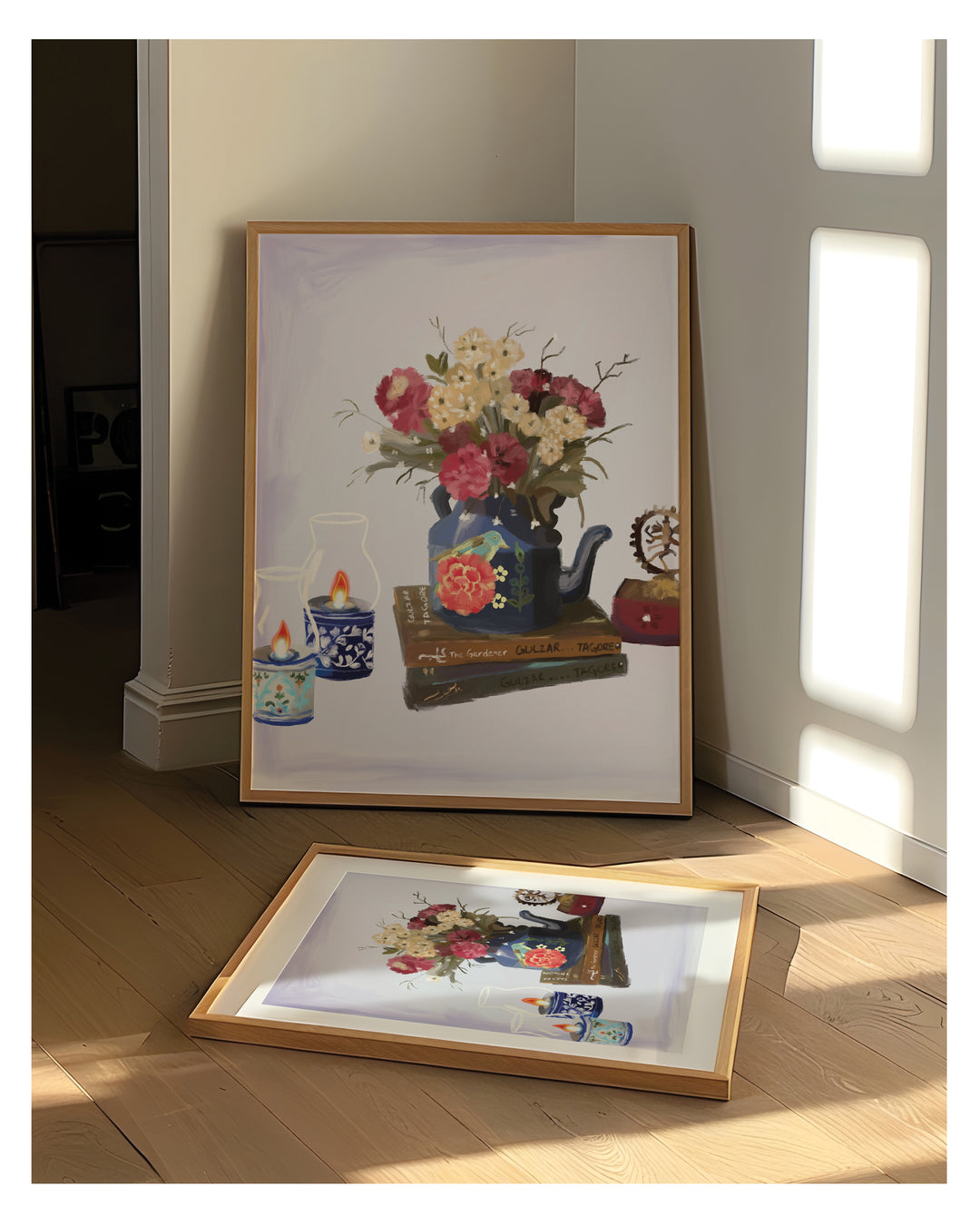 Framed artwork of a floral arrangement with teapots on a wooden floor.