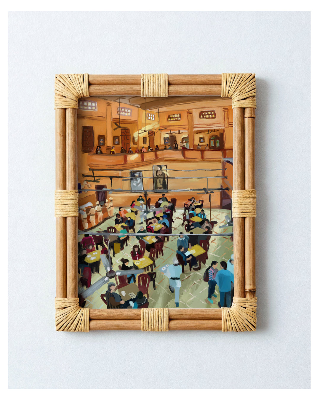 Framed artwork of a busy restaurant interior with a wicker frame.