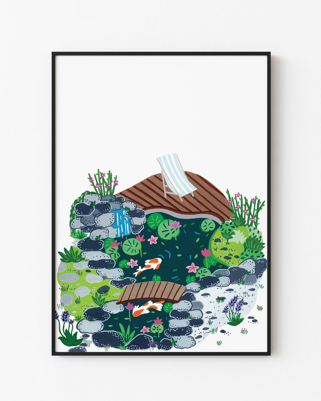 Black Framed Artwork of a peaceful garden scene with a small koi pond, surrounded by rocks, blooming plants, and a wooden deck with a striped deck chair.