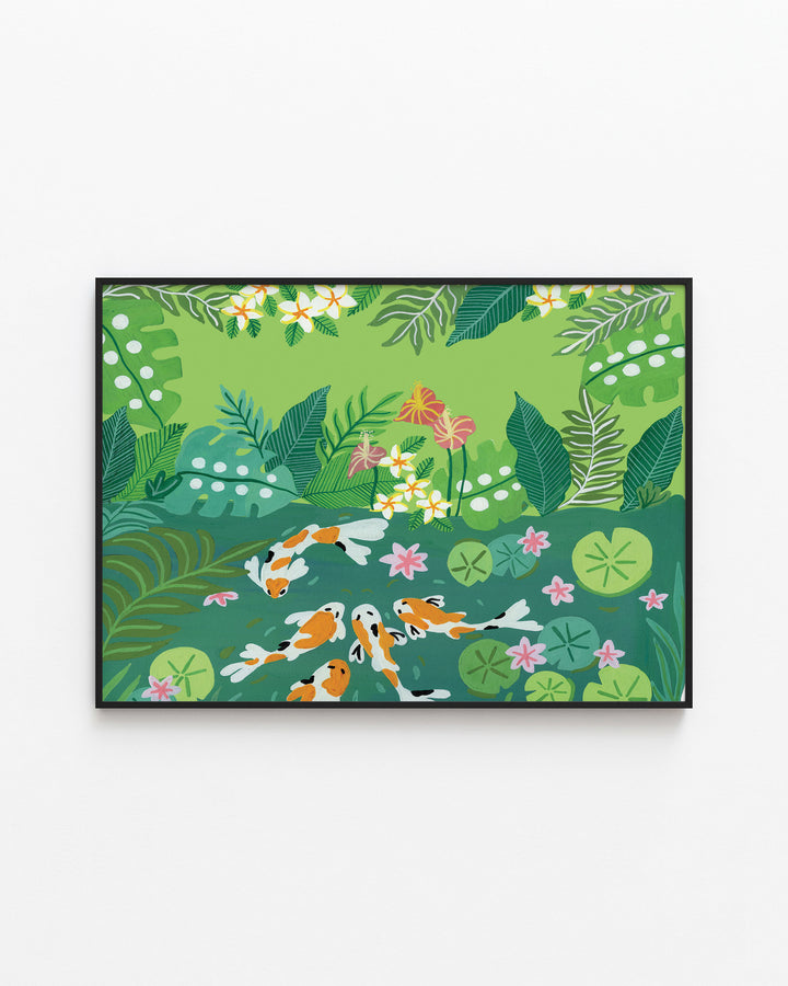 Black Framed Artwork of koi fish swimming in a lush green garden pond surrounded by vibrant tropical foliage and blooming flowers.