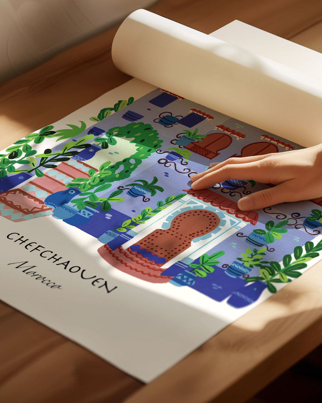 Archival  Art Print of a traditional Moroccan house in Chefchaouen by Little Berries Studio, featuring blue and white architecture, arched windows, and lush green plants.