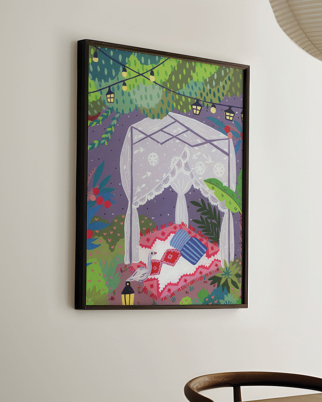 Ready-to-Hang Wall Art depicting a cozy outdoor scene under a canopy of trees. The centre features a draped canopy bed adorned with lace curtains, resting on a patterned red and white blanket with colourful cushions.