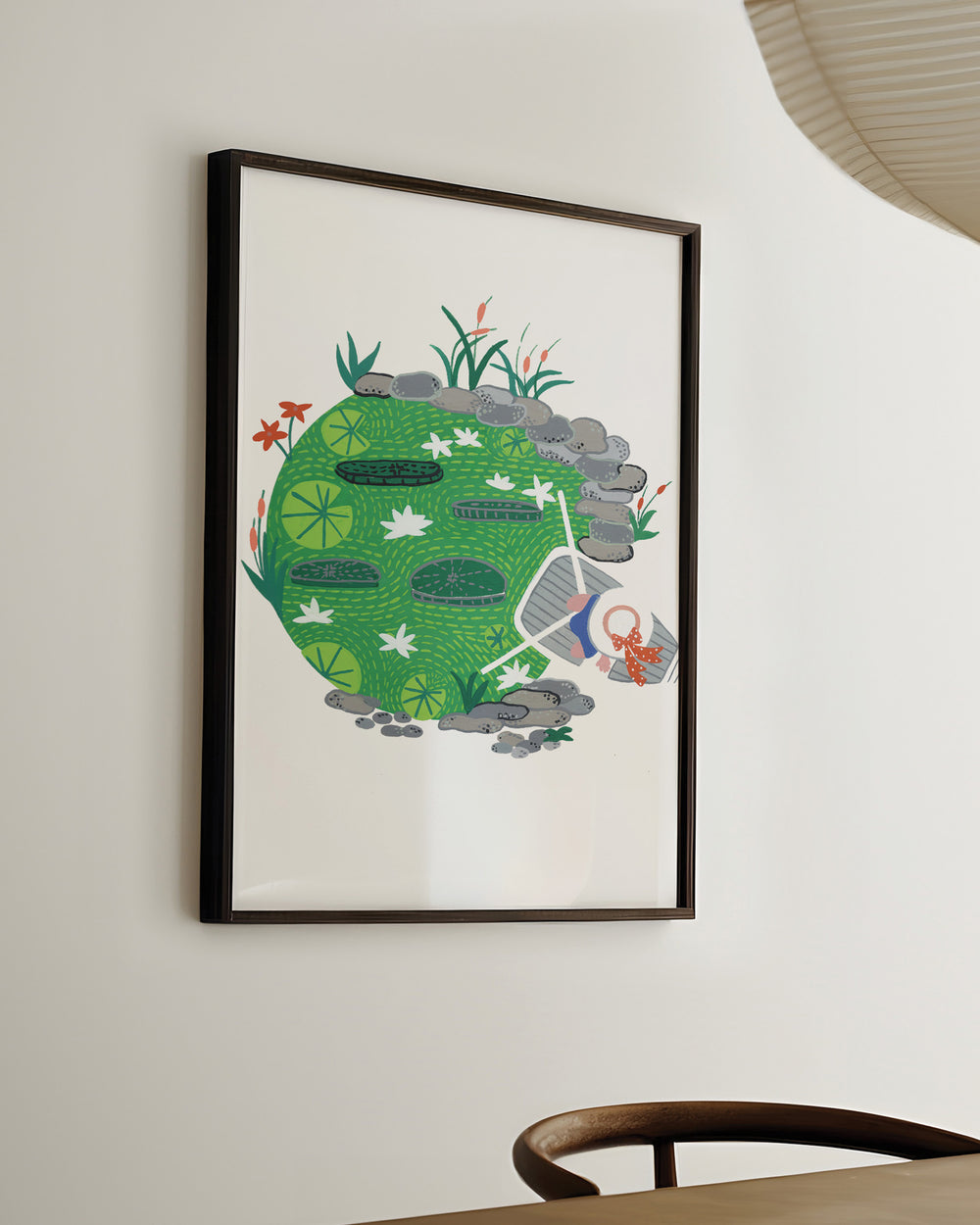 Ready-to-Hang Framed Artwork "Pondside Dreams" captures a serene pond scene filled with lily pads and vibrant greenery.