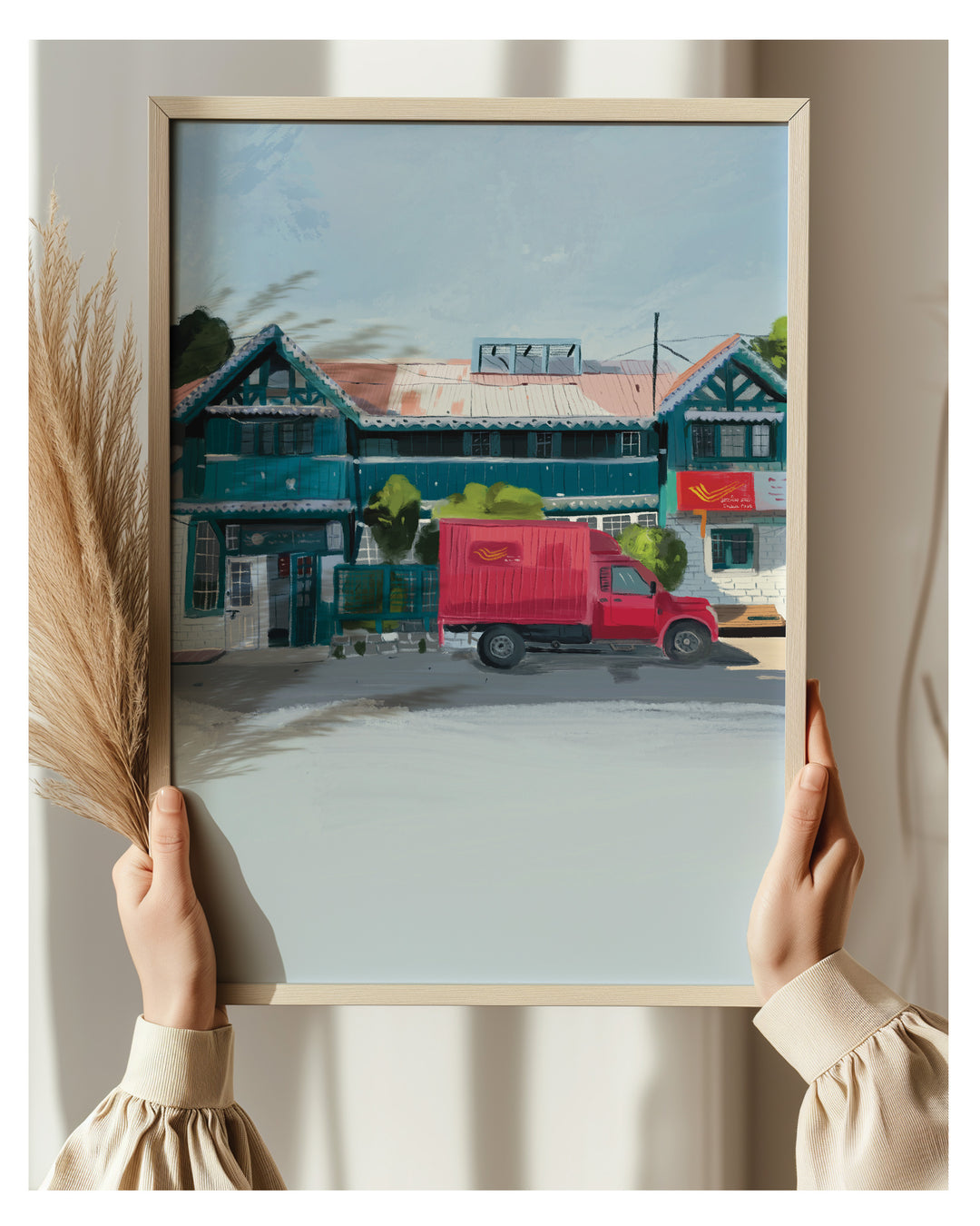 Framed artwork of a Shimla Post Office held by two hands.