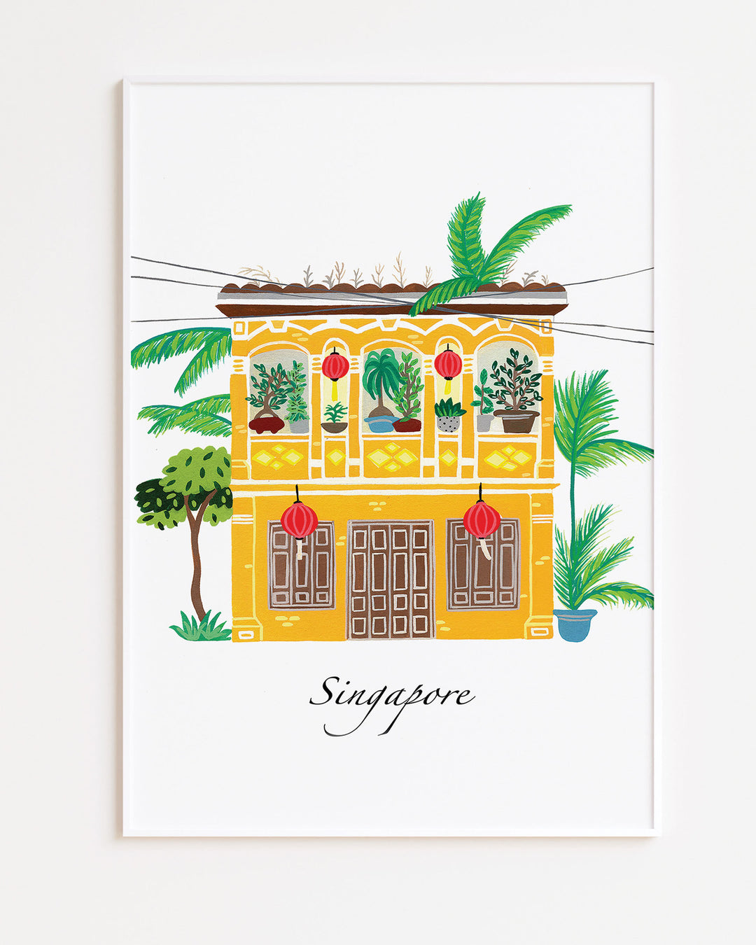 White Framed Artwork of a traditional Singaporean building with lush greenery and red lanterns, capturing the essence of Singapore. Archival Print by Little Berries Studio.