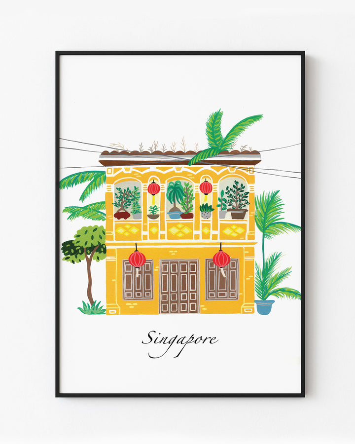 Black Framed Artwork of a traditional Singaporean building with lush greenery and red lanterns, capturing the essence of Singapore. Archival Print by Little Berries Studio.