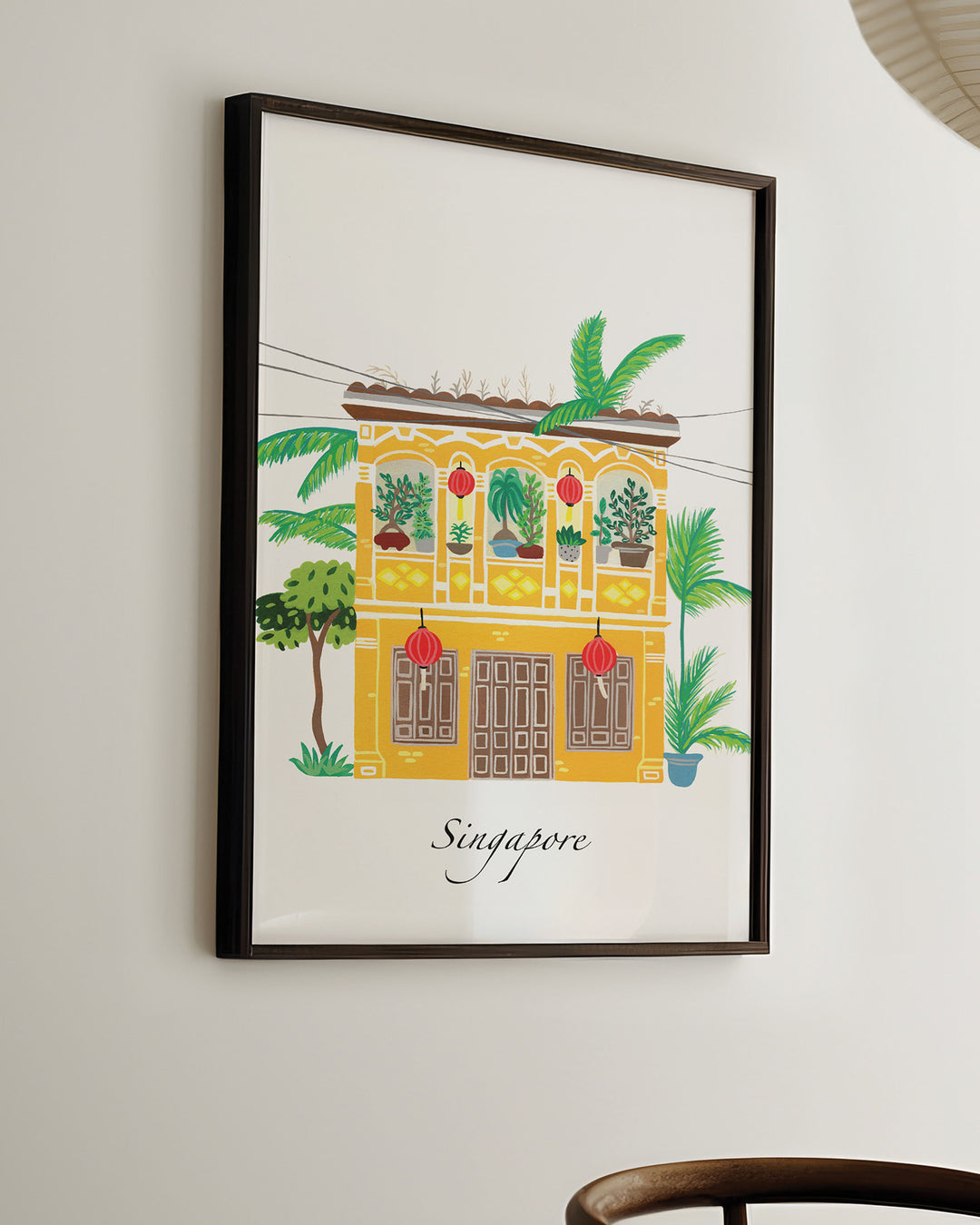 Ready-to-Hang Framed Wall Art of a traditional Singaporean building with lush greenery and red lanterns, capturing the essence of Singapore. Archival Print by Little Berries Studio.