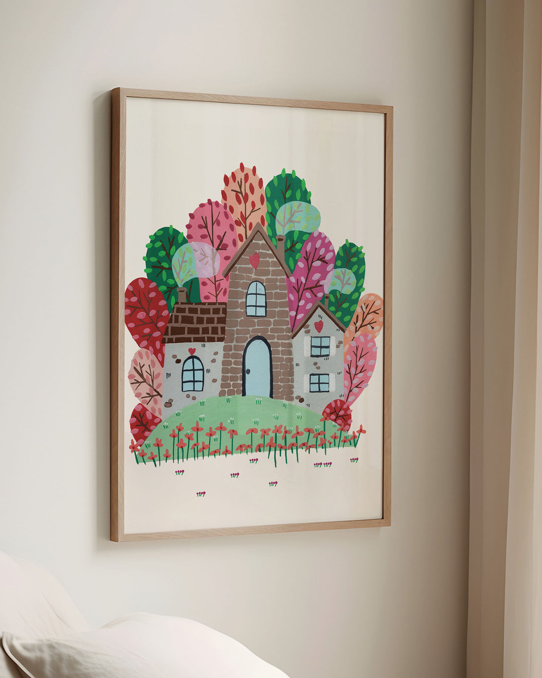 Framed Wall Art of a cozy Smoke House with a blue door and heart details, surrounded by vibrant, colourful trees and blooming red flowers, ideal for decorating kids' rooms.