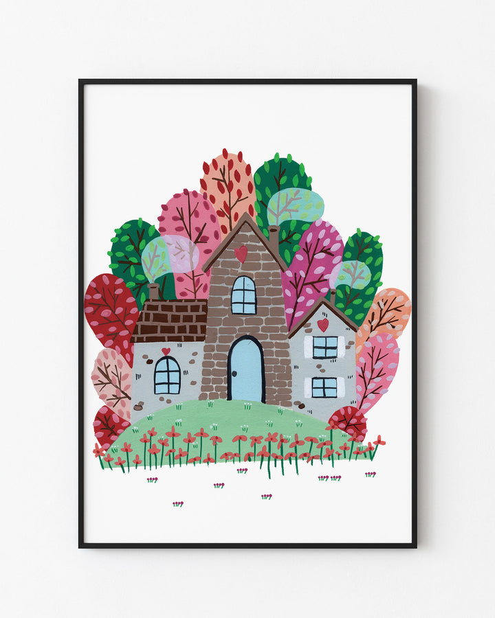 Black Framed Artwork of a cozy Smoke House with a blue door and heart details, surrounded by vibrant, colourful trees and blooming red flowers, ideal for decorating kids' rooms.