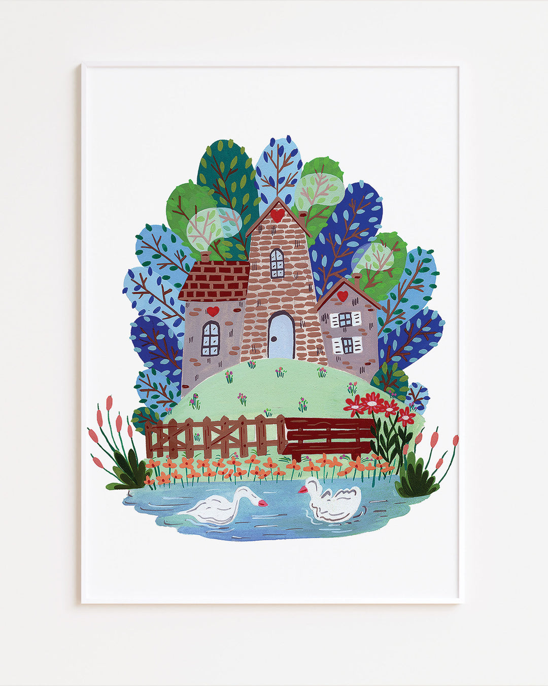 White Framed Artwork of 'Smokehouse Lakeside Serenity' a cozy stone house by a serene lake with two swans, surrounded by colourful trees and flowers, ideal for children's room decor.