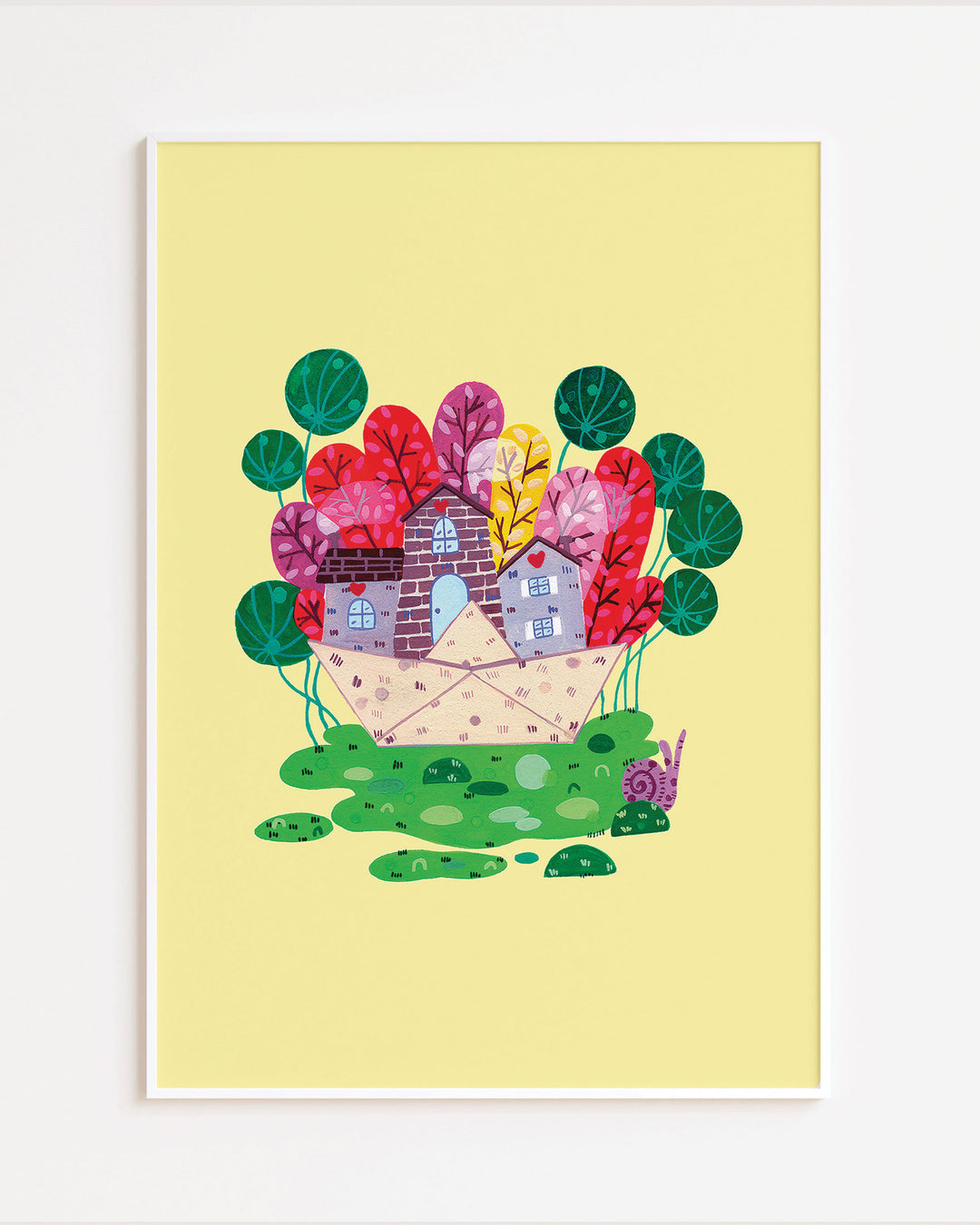 White Framed Wall Art of a cozy stone house nestled in a vibrant meadow, surrounded by colourful trees on a bright yellow background, ideal for decorating children's rooms.