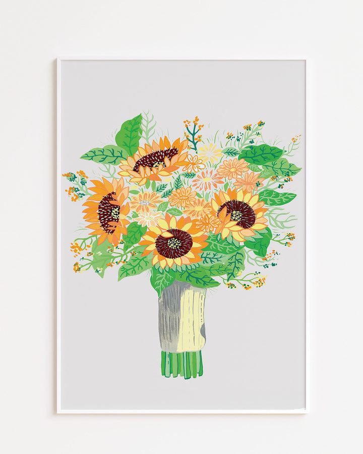 White framed Art Print by Little Berries Studio featuring a colourful bouquet of sunflowers and various flowers with green leaves, displayed against a light background.