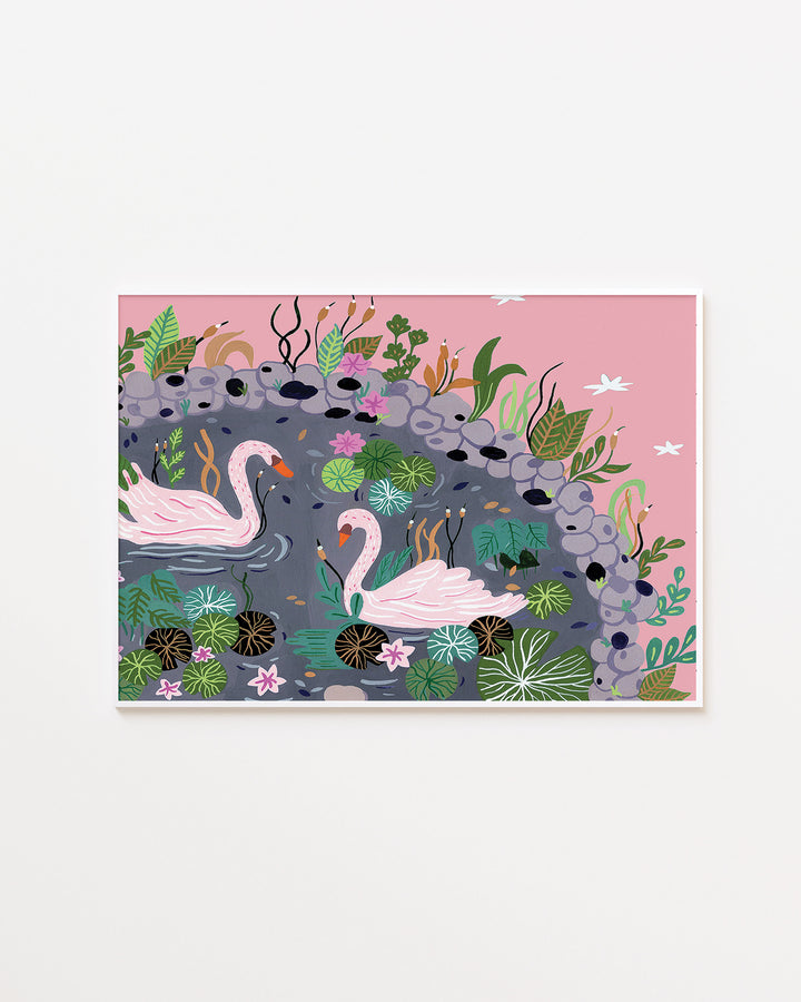 White framed Artwork featuring two pink swans swimming in a peaceful pond surrounded by lush green plants, lily pads, and delicate pink flowers, designed by Little Berries Studio.