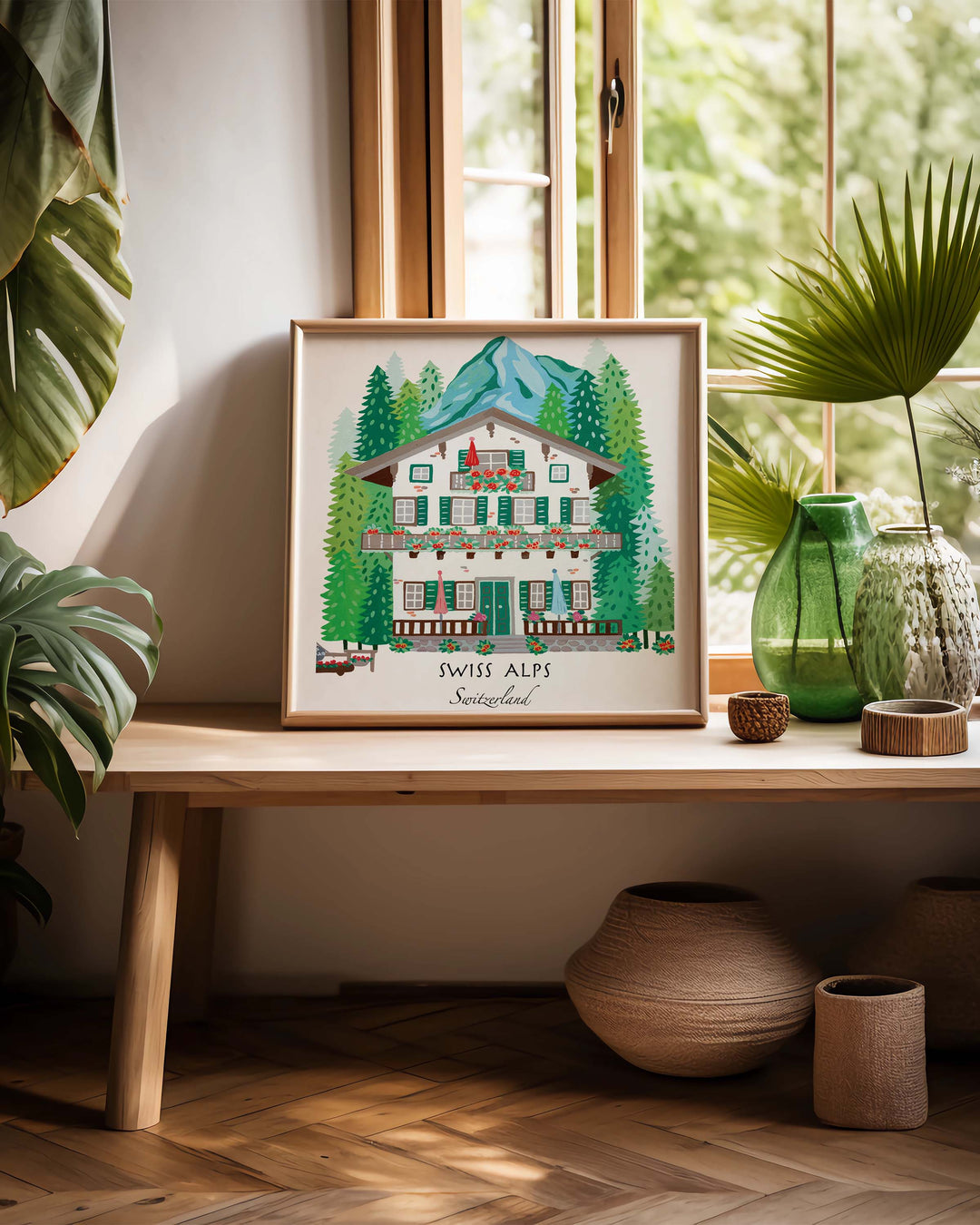 Charming Framed Artwork of a Swiss alpine chalet surrounded by lush pine trees and mountains, titled 'Swiss Alps, Switzerland,' by Little Berries Studio.