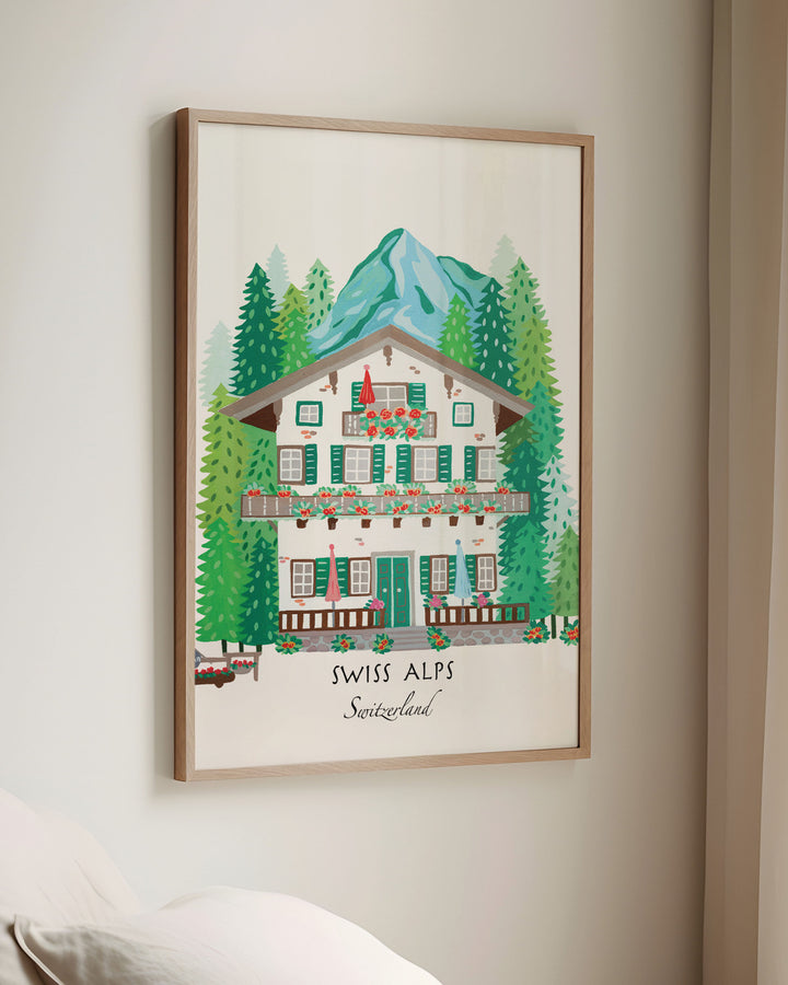 Framed Wall Art of a Swiss alpine chalet surrounded by lush pine trees and mountains, titled 'Swiss Alps, Switzerland,' by Little Berries Studio.