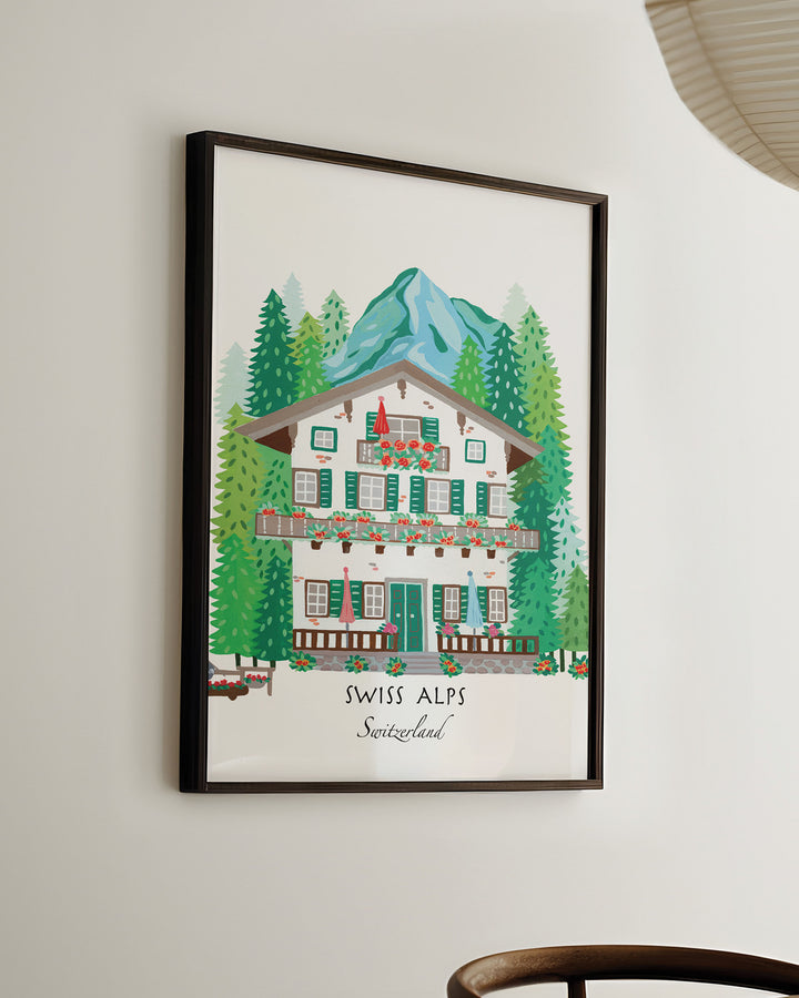 Ready-to-Hang Framed Wall Art of a Swiss alpine chalet surrounded by lush pine trees and mountains, titled 'Swiss Alps, Switzerland,' by Little Berries Studio.