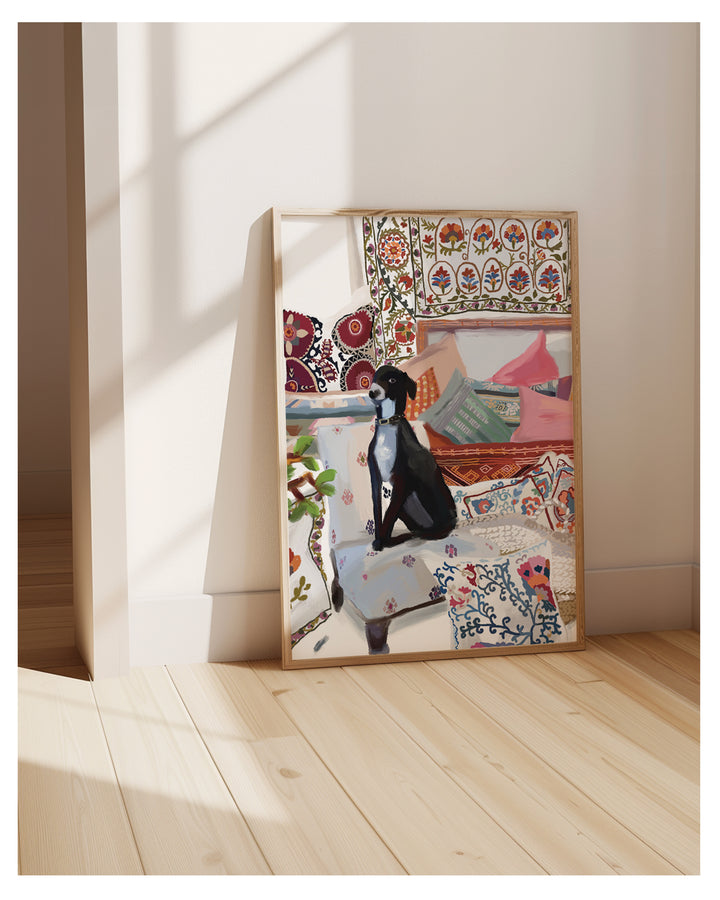 Framed artwork of dog on a sofa with colorful patterns in a minimalistic room.