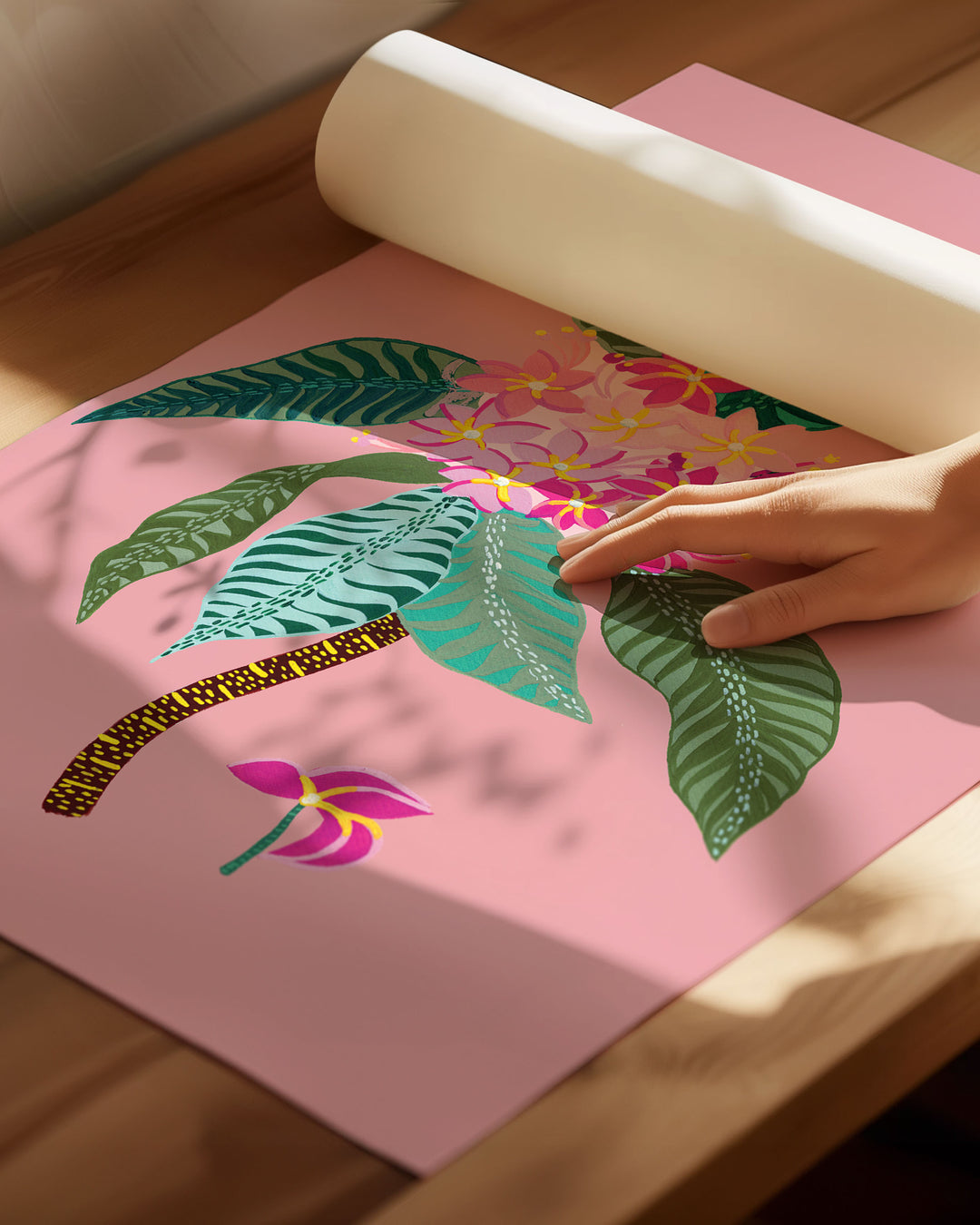 An Archival Art Print titled 'Tropical Bloom', featuring vivid floral patterns set against a soft pink background.